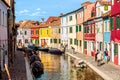 Burano island, Venice, Italy - September, 2017: Colorful houses in Burano near Venice, Italy with boats, canal and tourists. Royalty Free Stock Photo