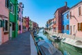 Burano island water canal, colorful houses and boats, Venice, Italy Royalty Free Stock Photo