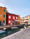 BURANO, ITALY - JANUARY 20, 2020: Colorful houses on the island of Burano in Italy. Burano island is famous for its colorful