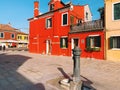 BURANO, ITALY - JANUARY 20, 2020: Colorful houses on the island of Burano in Italy. Burano island is famous for its colorful