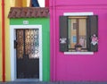 Burano, Venezia, Italy. Details of the windows and doors of the colorful houses in Burano island