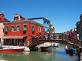 Burano, Venezia, Italy. View of the colorful houses along the canals at the Islands during a weekend with a lot of tourists