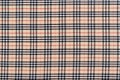 Burberry tartan fabric texture in beige, black and red. Image for your design October 26, 2023 in Kyiv, Ukraine