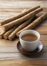 Burdock tea on a wooden board in the background