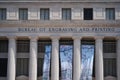 Bureau of Engraving and Printing government building office with sign and sakura banner. Royalty Free Stock Photo