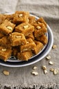 Burfi - indian sweet with milk, chickpea flour, coconut flakes