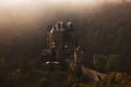 Burg Eltz fairy tale castle in the fog Royalty Free Stock Photo