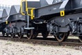 Burgas, Bulgaria - January 24, 2017. Freight cargo train - black cars wagons. New 6-axled flat wagon ,Type: Sahmmn, Model WW 6