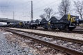 Burgas, Bulgaria - January 24, 2017 - Freight cargo train - black cars wagons - New 6-axled flat wagon - Type: Sahmmn - Model WW 6 Royalty Free Stock Photo