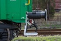 Burgas, Bulgaria - March 20, 2017 - Freight cargo train Buffer- 4axled box wagon green Type:Eanos Model:155-1 - Transvagon AD