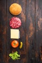 Burger banner. Raw ingredients for burger, on old dark  wooden table background, top view flat lay, with copy space for text Royalty Free Stock Photo