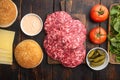 Burger banner. Raw ingredients for burger, on old dark  wooden table background, top view flat lay Royalty Free Stock Photo