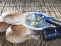 Burger bun bread garlic and pepper crushed on top wood table