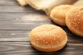 The burger buns with spikelet on a brown background Royalty Free Stock Photo