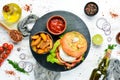 Burger with camembert cheese and meat. French fries and ketchup. Top view, Royalty Free Stock Photo