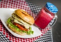 Burger with cheese tomato and a drink Royalty Free Stock Photo