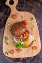 Burger with cherry tomato, green sprout and fried egg Royalty Free Stock Photo