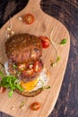 Burger with cherry tomato, green sprout and fried egg Royalty Free Stock Photo