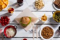 Burger and chips with pickles.