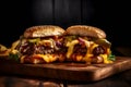 Burger cross-section with cheese, lettuce, sauce, onion and cucumber on a wooden board, black background Royalty Free Stock Photo