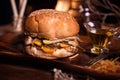 Burger food photo. Street food. Fresh tasty grilled beef hamburger cooked at barbecue on wooden table. Big cheeseburger