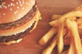 Burger and French fries on a wooden Board.the view from the top