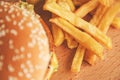 Burger and French fries on a wooden Board the view from the top