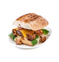Burger handmade with beef chop and mushrooms chanterelles on an oval plate on a white background