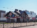 Burger King.restaurant on the side of the city road next to the trolley bus stop