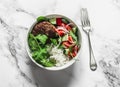 Burger lunch bowl. Beef patty with rice and fresh vegetable salad on a light background, top view