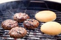 Burger meat cutlets roasting on barbecue grill Royalty Free Stock Photo