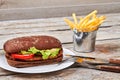 Burger with meat and vegetables. Royalty Free Stock Photo