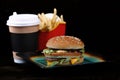 Burger, paper Cup with coffee and French fries