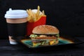 Burger, paper Cup with coffee and French fries