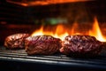 burger patties under the focused beam of a grill light