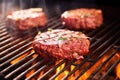 burger patty on barbecue grill with thermometer checking Royalty Free Stock Photo