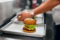 Burger Restaurant. Closeup Chef Cooking Burgers In Kitchen. Royalty Free Stock Photo