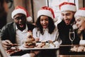 Burger. Santa`s Hat. Girls and Guys. Young People.