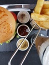 Burger sauces cutlery plate beer metal metalbasket chipbasket