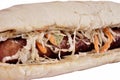 Burger with sausage in with a long bun isolated on white background Royalty Free Stock Photo