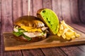 Burger with turkey on a wooden board Royalty Free Stock Photo