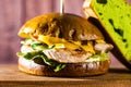 Burger with turkey on a wooden board Royalty Free Stock Photo