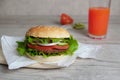 Burger on a  with tomatto juice Royalty Free Stock Photo