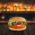 Burger at wooden tabletop with blurred bar at backdrop. One hamburger at wooden table. Fastfood advertising concept