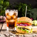 Burgers with beef and glass of cold cola