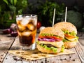 Burgers with beef and glass of cold cola