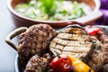 Burgers. Grill burgers. Minced burgers. Roasted burgers with grilled vegetable and herb decoration. Minced meat grilled in a hotel Royalty Free Stock Photo