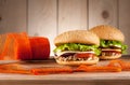 Burgers with meat turkey, cheese and vegetables Royalty Free Stock Photo