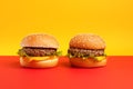 Burgers tasty fast food street food for take away on yellow background