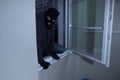 Burglar Breaking Into A House Royalty Free Stock Photo